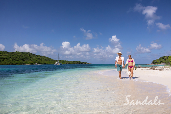 couple walking on the beach in St Vincent